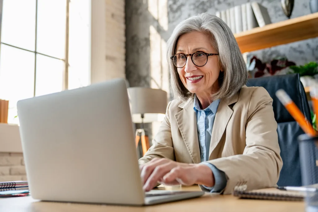Woman using laptop to make a referral